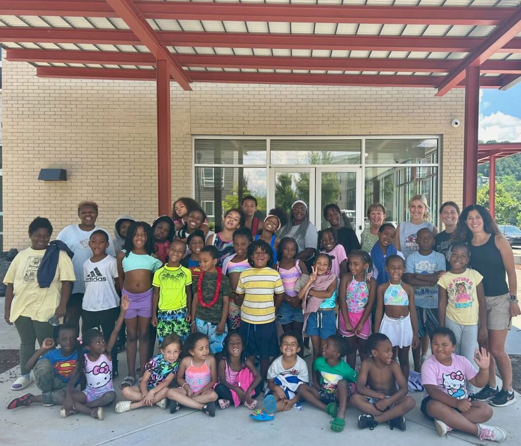 large group of kids outside of school building