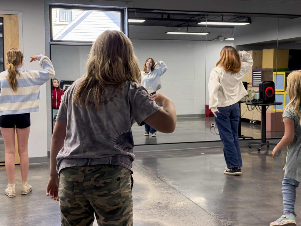 students dancing in classroom